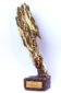Sculptural award statuette with bark, gold and resin
